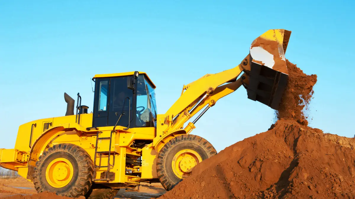 wheel loader excavator Yellow wheel loader excavator moving earth