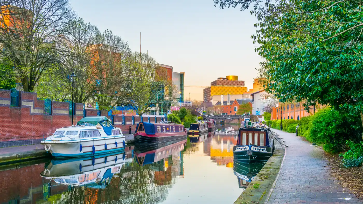 Sunset view of brick buildings and canal water channel in Birmingham Sunset view of brick buildings and canal water channel in Birmingham